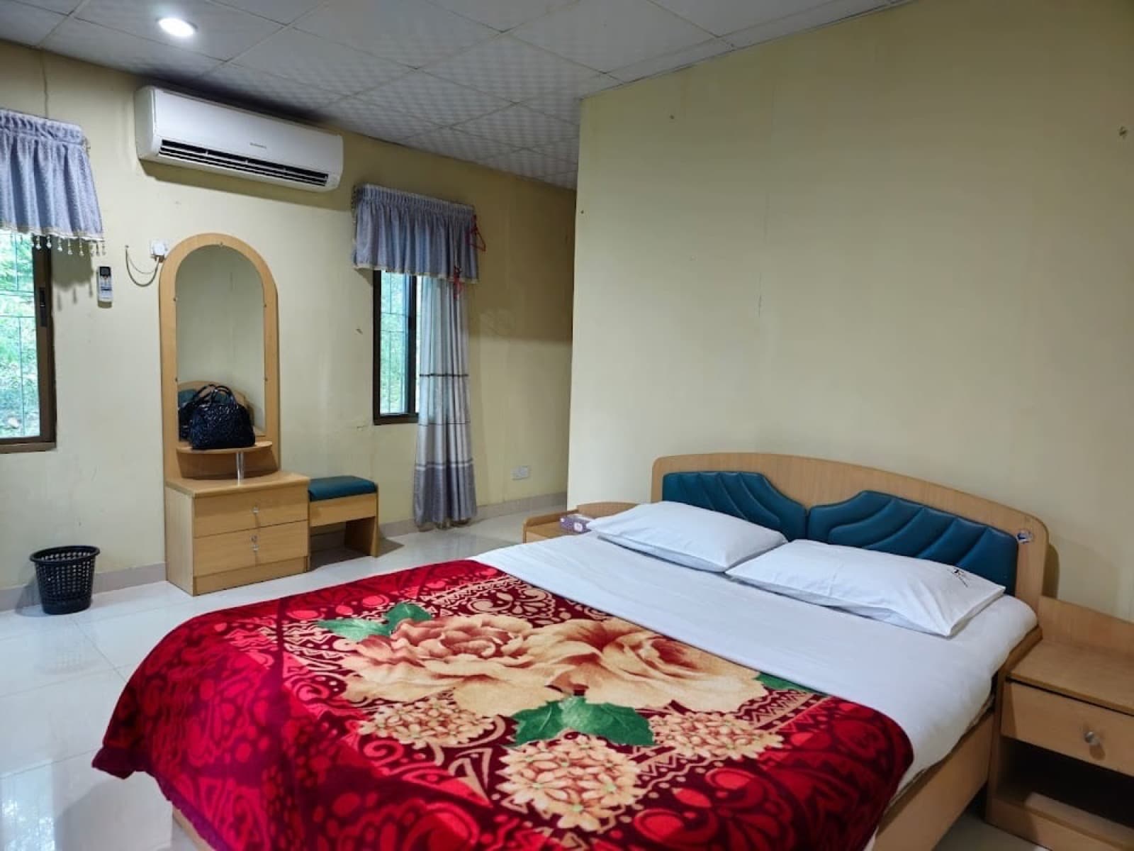 A simply furnished bungalow room at the Sreemangal Tea Resort and Museum